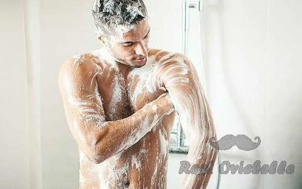 Man taking a shower. Body Wash Vs Bar Soap