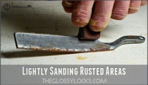 lightly sanding rusted areas