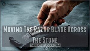 moving the razor blade across the stone