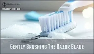 gently brushing the razor blade